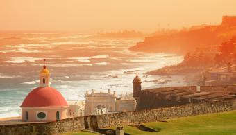 The view of a sunset over the old town of San Juan 